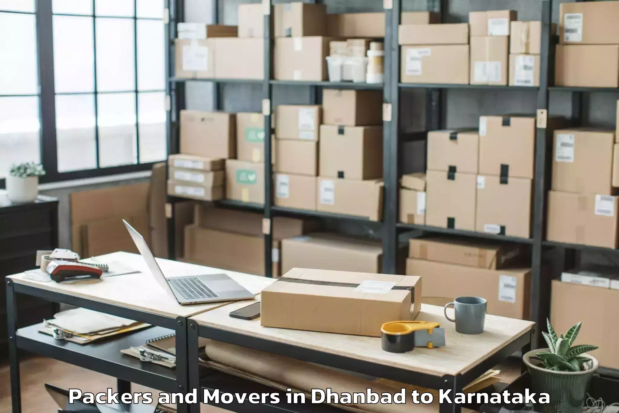 Easy Dhanbad to Karnataka Janapada Vishwavidya Packers And Movers Booking